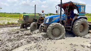 John Deere and  new holland tractors working in mud | tractor | | John Deere |