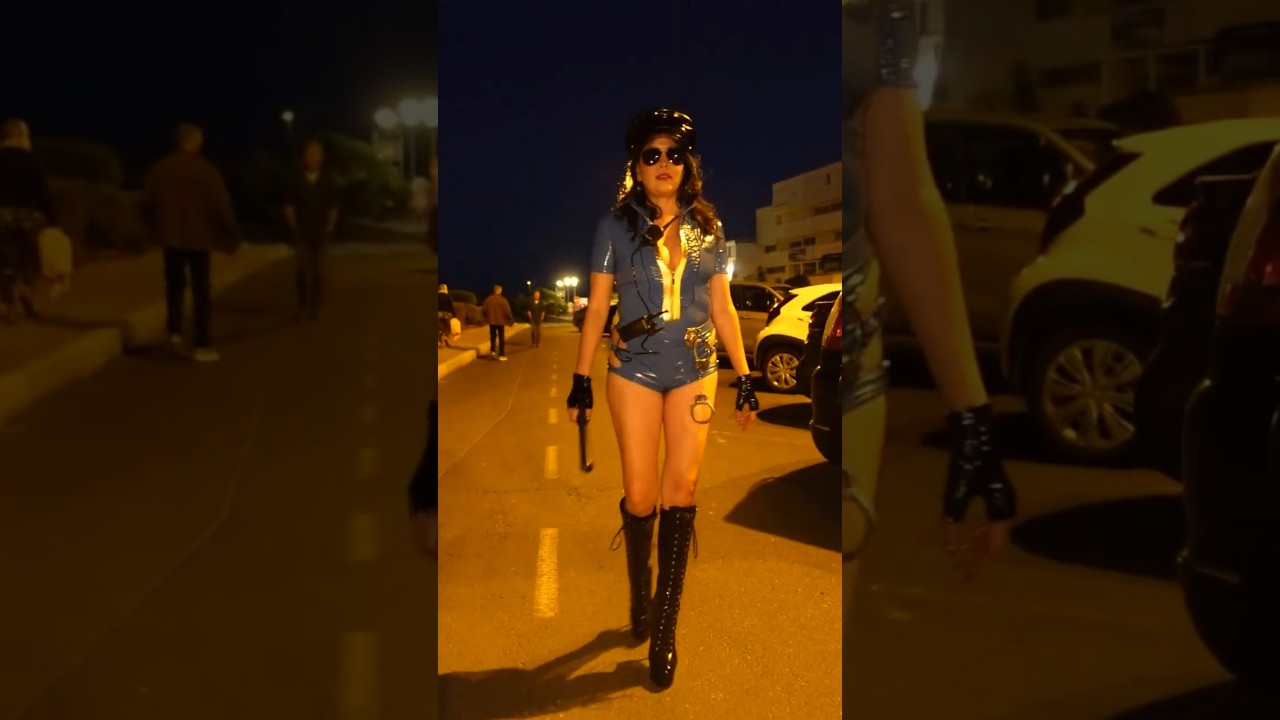 Police Woman in PVC Walking the Beat