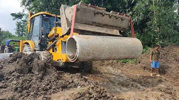JCB Lifting Heavy Culvert Pipe and Installing in Drain - JCB Video