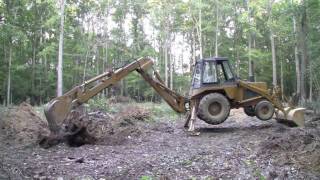 Case 580C Backhoe - Digging out three big stumps - Part 1 (HD)
