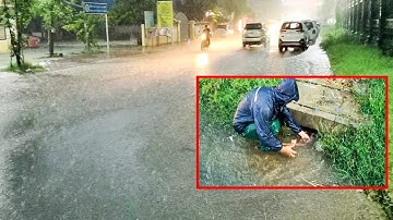 Remove All Debris And Grass Grow Clogged Culvert Drain While Heavy Rain
