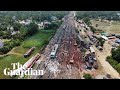 Drone footage shows authorities clearing tracks after deadly train crash in India