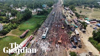 Drone footage shows authorities clearing tracks after deadly train crash in India