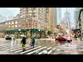  walking in strong rainstorm in new york city during rush hour