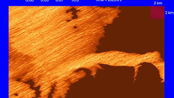 Large eddy simulation (LES) of wind over complex terrain