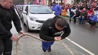 Lithuanian man breaks world record for most cars pulled by an individual - no comment