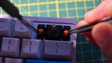 Applying lube to one of the worst stabilizers I have come across, without de-soldering