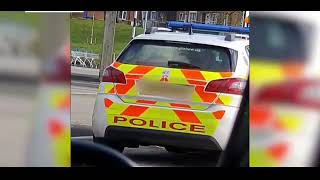Two police officers are forced to apologise after they were caught kissing in patrol car at Tesco