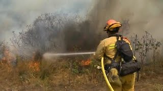 California homes evacuated as crews battle raging wildfires