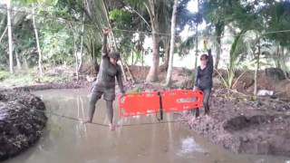 ORACIS SPL RESCUE GRP WITH SPINE BOARD CROSSING MONKEY BRIDGE.