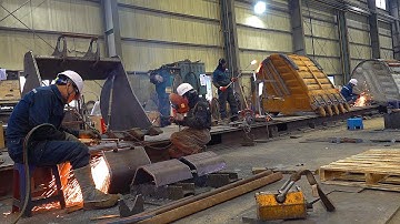 Process of Making a Steel Volvo Excavator Bucket. Heavy Equipment Factory in Korea.