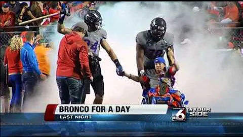 Shane Swanson leads Broncos onto field