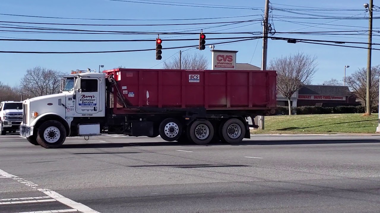 Berry's Container Service Peterbilt 357 roll off with a Cummins ISM