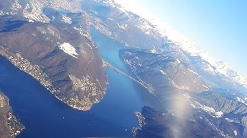 Winter Flight over the Swiss Alps and Visual Approach in Lugano LSZA