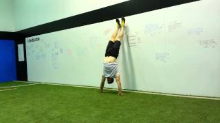Iso wall handstand leg scissors