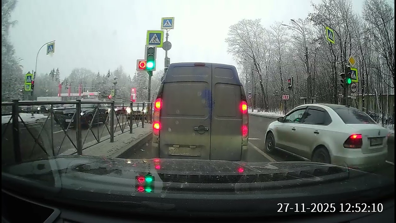 Police car struck during left turn at busy intersection in St. Petersburg, Russia