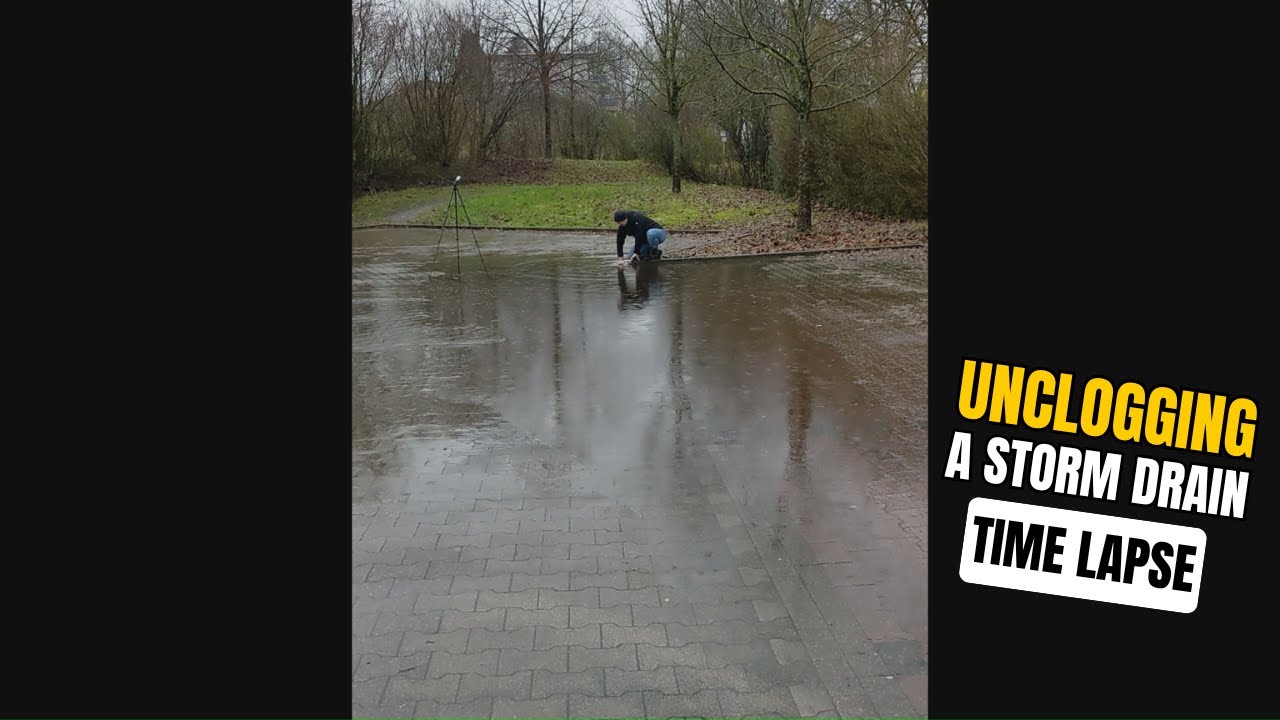 #011-2 - Time Lapse - Unclogging a storm drain after rain on a parking ...