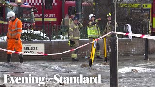 Burst water main floods residential road in Camden