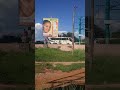Tahmeed bus in Kisumu Kenya passing near a Garnier billboard