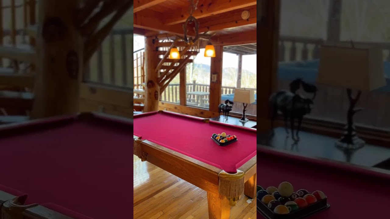 Stunning 3-bedroom, 3.5-bath cabin with a hot tub, game room, two decks, and Smoky Mountain views!