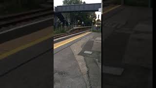 Train class 166 passes Gomshall at speed!