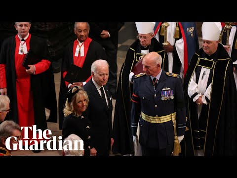 Joe Biden waits for seat after apparent late arrival at Queen’s funeral