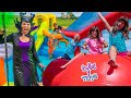 Elsa and Maleficent Surprise Twin Sisters with GIANT Inflatable Bounce Houses!