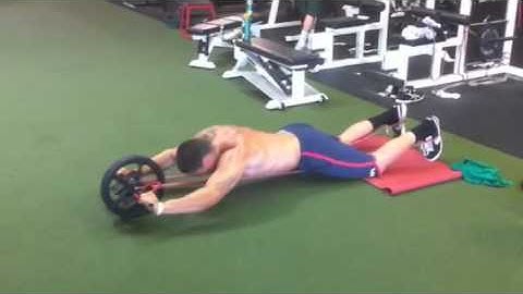 Assisted mini band ab wheel roll outs