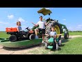 Working on tractors and playing in the water | Tractors for kids on the farm