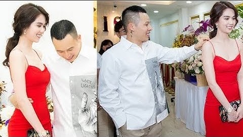 Vũ Khắc Tiệp chỉnh váy cho Ngọc Trinh ở event.