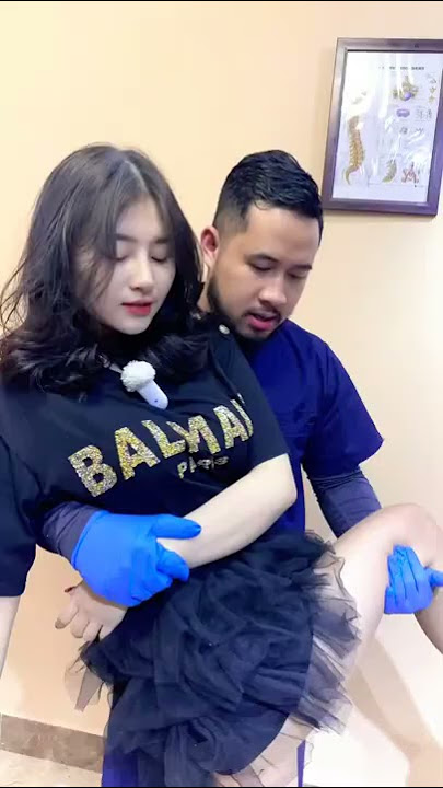 Hot Asian girl doing chiropractic