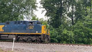 Empty CSX grain trains run from the rain on the Clinchfield