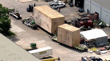 Giant moving crates behind schedule again