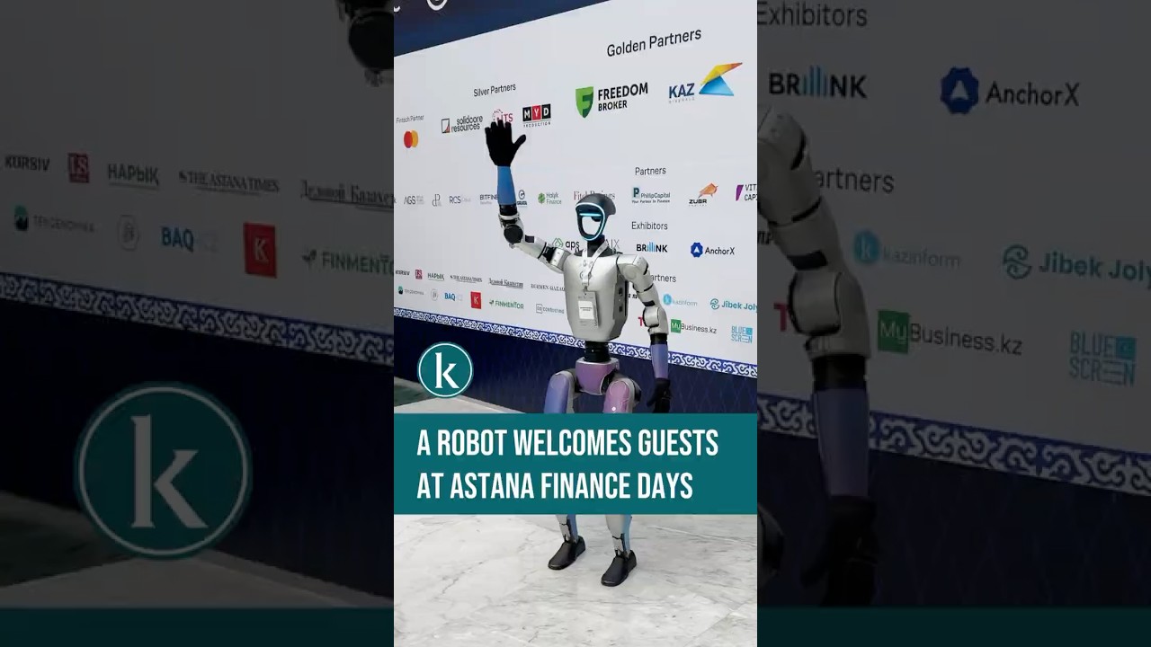 Robot welcomes guests at Astana Finance Days - YouTube