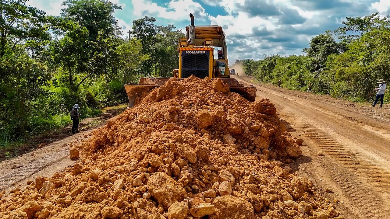 Perfect Coordination! Bulldozer and Dump Truck Preparing a Strong Road Foundation.