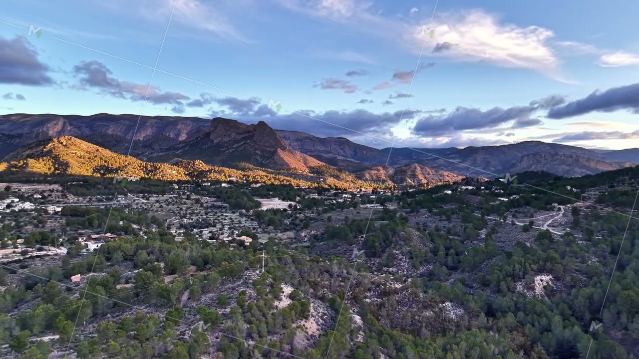 Mountain town sunset, Sunlit peaks over peaceful valley, Serene valley with town and shining peaks