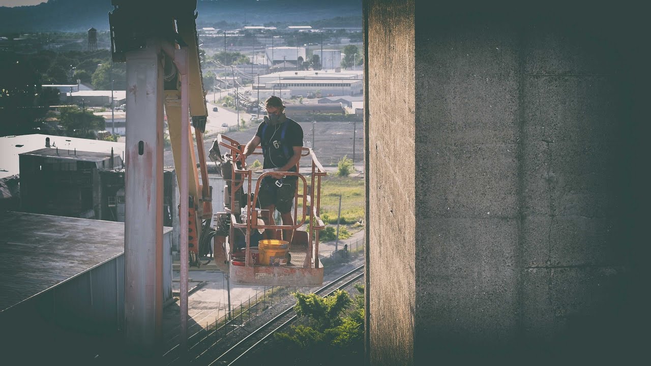 Silo Mural - Day 4 - Wind is the Enemy - Guido van Helten
