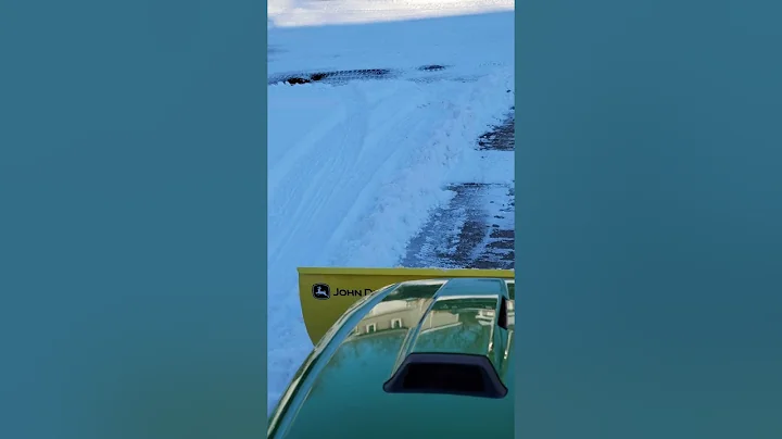 My new John Deere x730 pushing a little snow