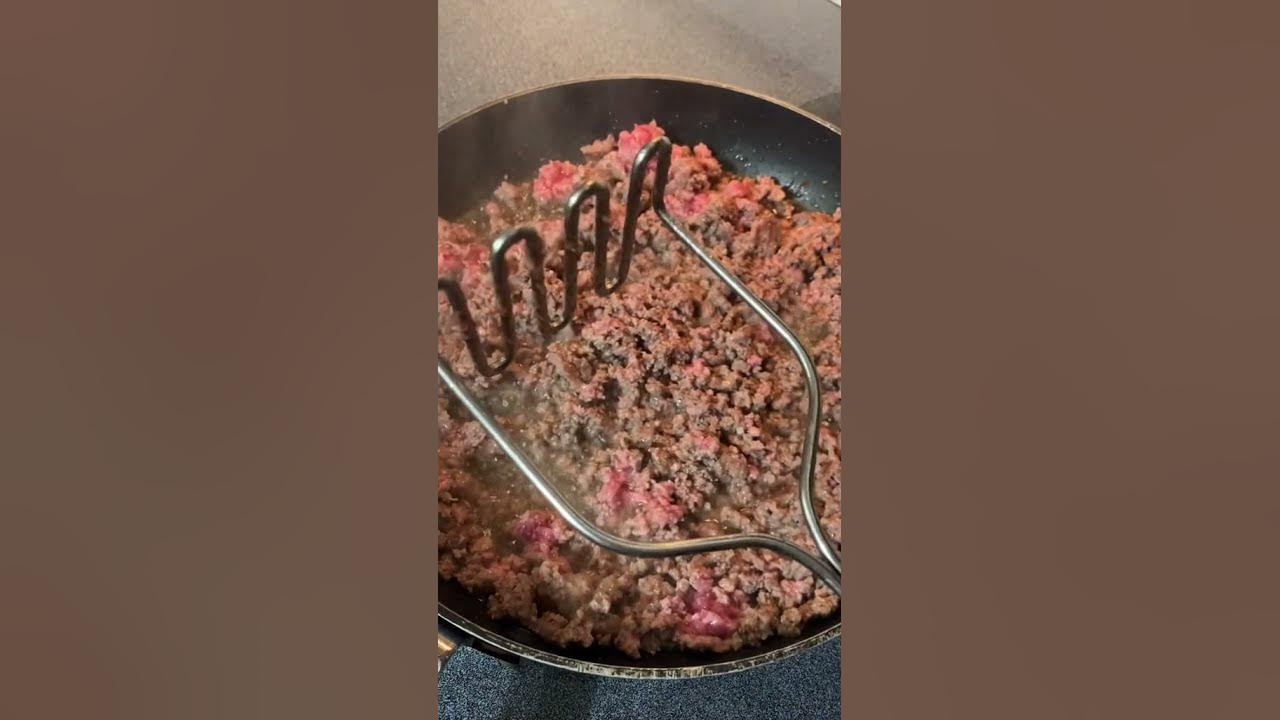 Use Your Potato Masher To Break Up Ground Meat in the Skillet