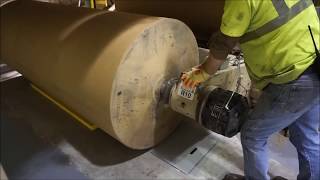 Harmax roll nudger aligns paper core to core chucks