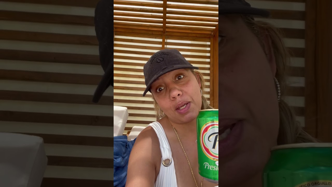 Drinking Dominican beer Presidente 