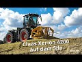 Claas Xerion 4200 auf dem Silo. Warum macht man Silagen und wie funktioniert das?