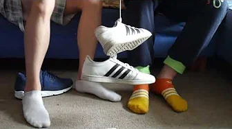 Two guys show their shoes, socks and feet
