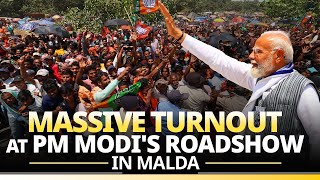 PM Modi waves at massive crowd as he holds a roadshow in Malda