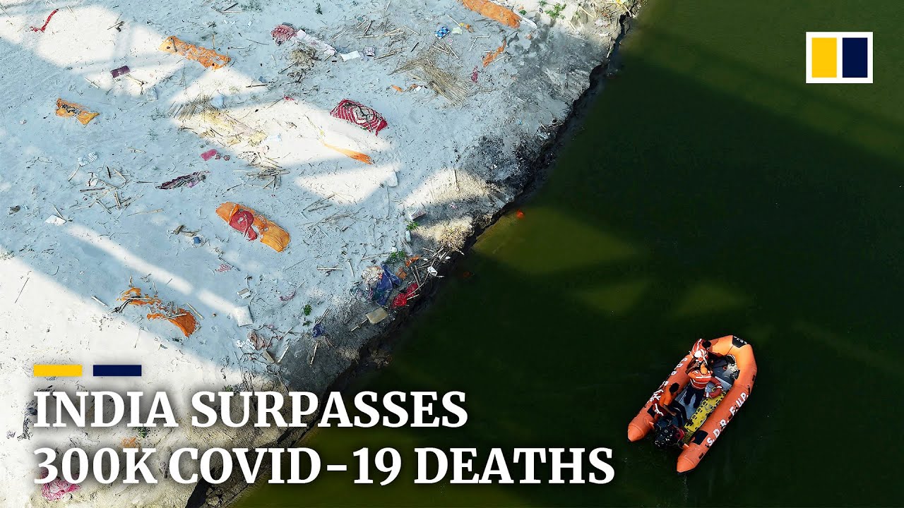 India passes 300,000 coronavirus deaths as mass graves found along Ganges