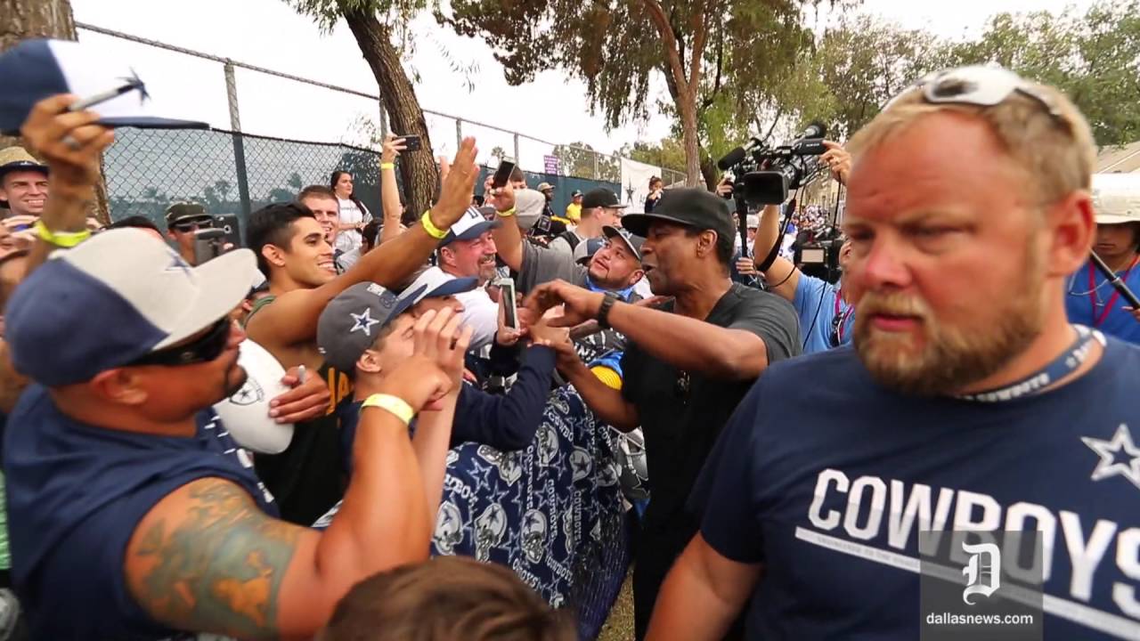 Dallas Cowboys fan and actor Denzel Washington greets fans at Training Camp
