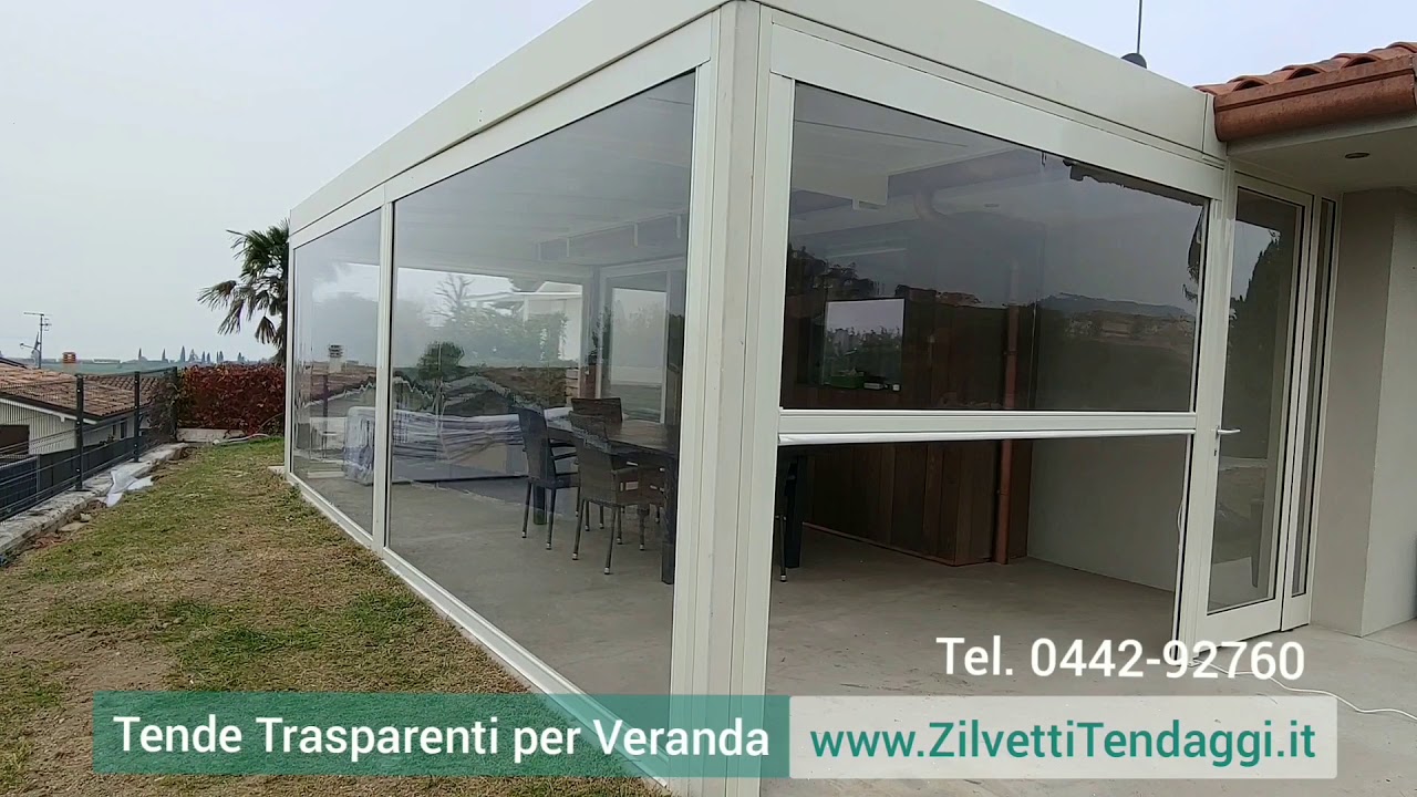 Chiusura veranda in ferro con tende pvc trasparenti lago di Garda 