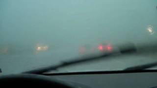 Driving into a heavy rain storm.