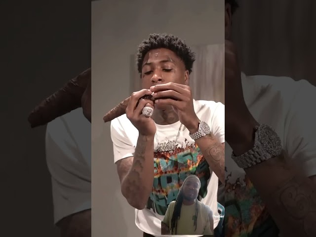 YoungBoy struggling to roll a backwood 😅😂 class=