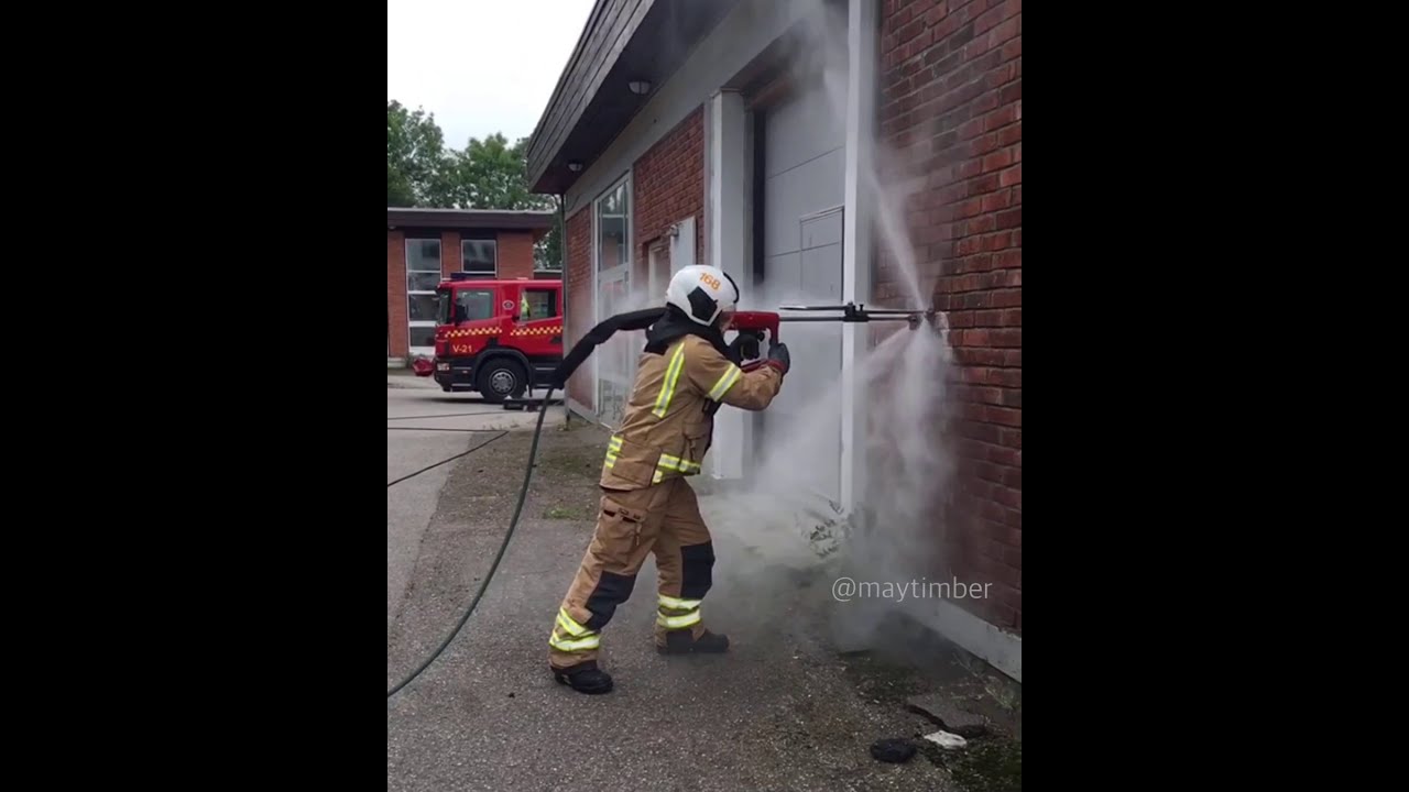 Cobra cutting extinguisher shooting through a brick and concrete wall.